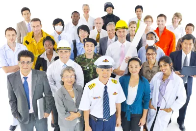 a group of people with different work uniform posing for a photo